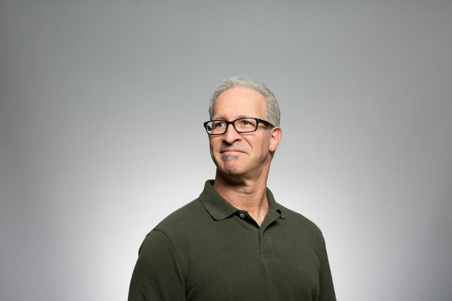Portrait of an editor with notebook on a studio shelf